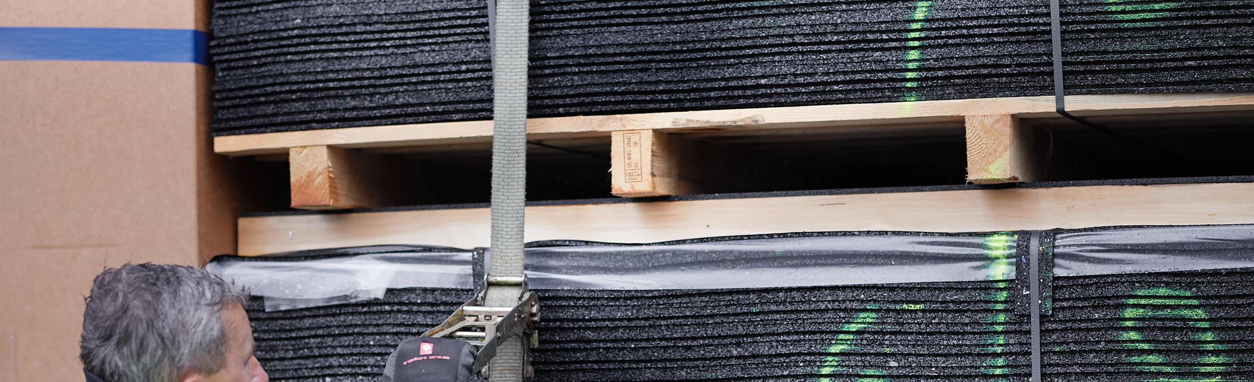 Truck loaded with anti-slip mats.